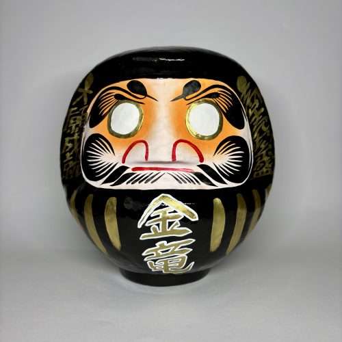 Custom made black and gold daruma doll